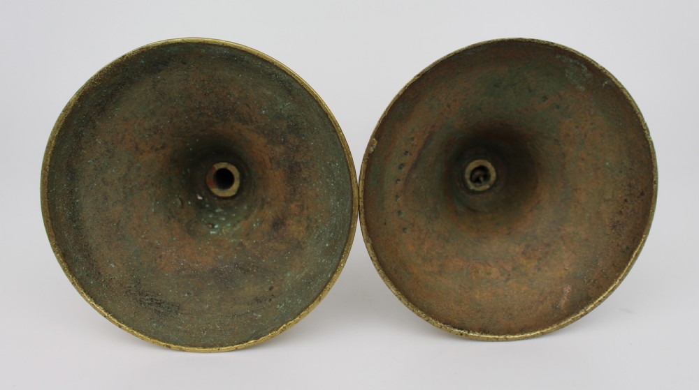 A pair of 19th-century brass candlesticks featuring turned baluster stems and rounded circular bases. View III