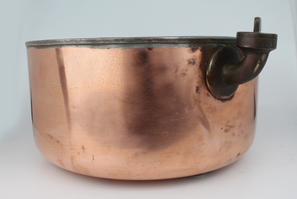 A large round antique copper bain marie pan featuring a dark tin-lined interior and side handles. View III