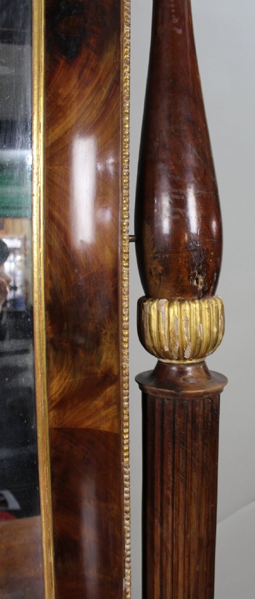 An antique mahogany pier console table featuring carved parcel gilt columns, ebonised monopodia legs with paw feet, and an integrated rectangular pier mirror. View XI