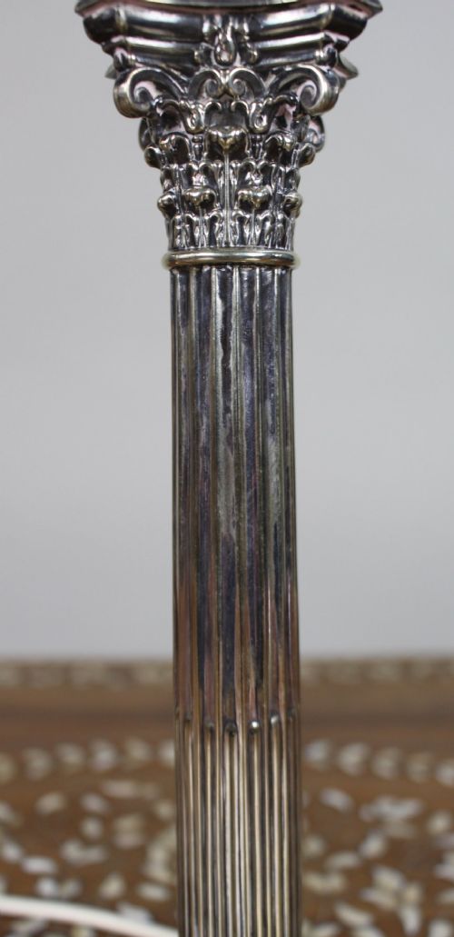 A silver-plated table lamp featuring a fluted Corinthian column shaft, a stepped square base, and a cream pleated fabric shade. View VIII