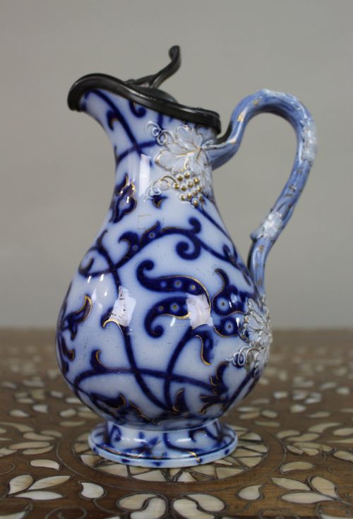 Victorian Flow Blue Relief-moulded Jug with Pewter Lid, C.1850