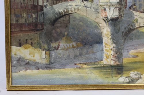 fig 2. A 19th-century framed watercolour painting depicting an Italian townscape with a stone arch bridge crossing a river beneath a pale blue sky.