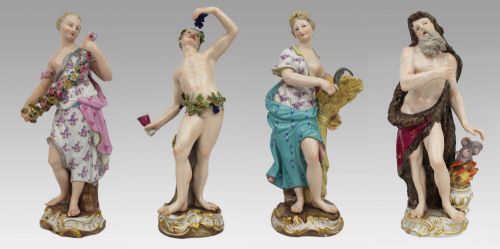 fig 1. A set of four 19th-century hand-painted porcelain figurines representing the seasons standing on gilded scroll bases.