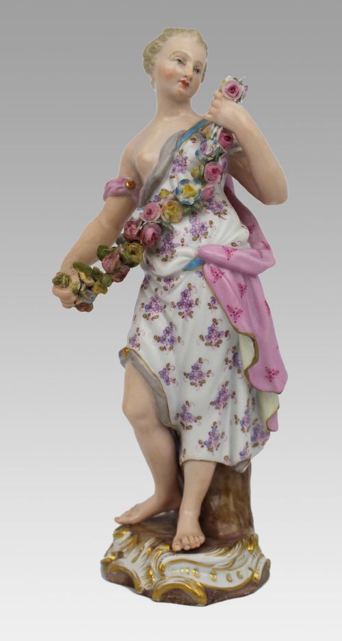 fig 2. A set of four 19th-century hand-painted porcelain figurines representing the seasons standing on gilded scroll bases.