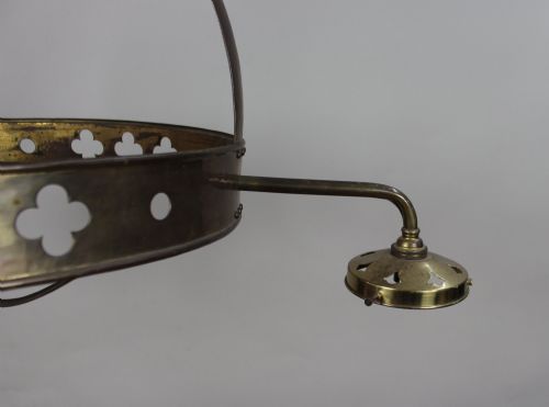 fig 1. An antique Gothic Revival brass three-light gasolier frame with pierced strapwork alongside three ruffled opalescent glass shades.
