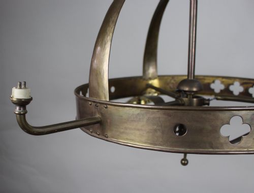 fig 2. An antique Gothic Revival brass three-light gasolier frame with pierced strapwork alongside three ruffled opalescent glass shades.