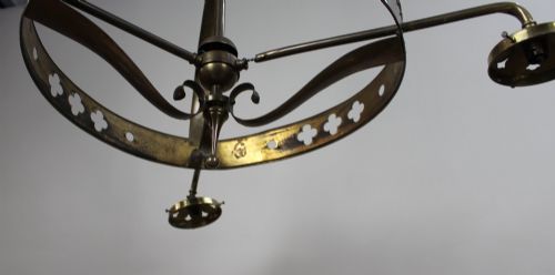 fig 3. An antique Gothic Revival brass three-light gasolier frame with pierced strapwork alongside three ruffled opalescent glass shades.
