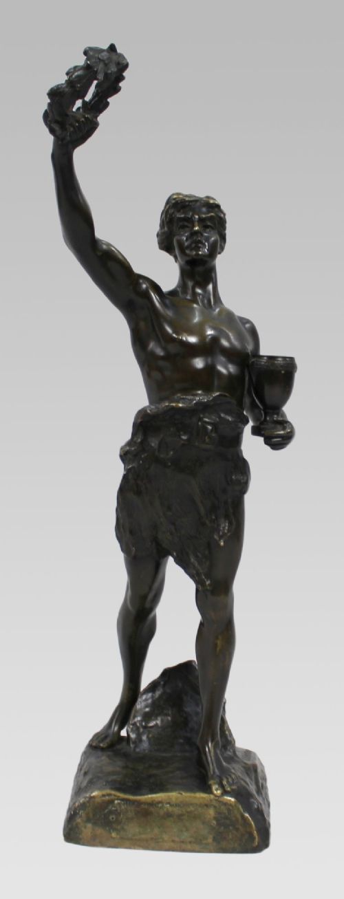 A dark patinated bronze figure of a classical male holding a raised wreath in one hand and a vessel in the other. View VII