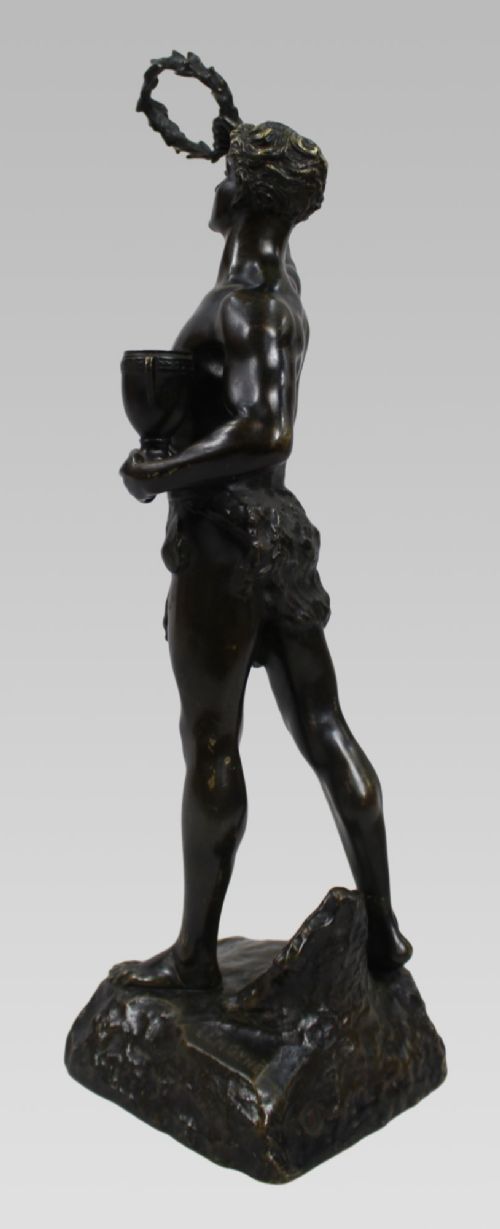 A dark patinated bronze figure of a classical male holding a raised wreath in one hand and a vessel in the other. View IX