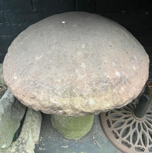 A two-piece antique sandstone staddle stone featuring a rounded mushroom cap resting on a tapered cylindrical pedestal base with moss coverage. View III