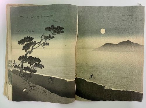 An open Japanese crepe paper calendar from 1903 displaying muted woodblock illustrations and crinkled paper texture. View XII