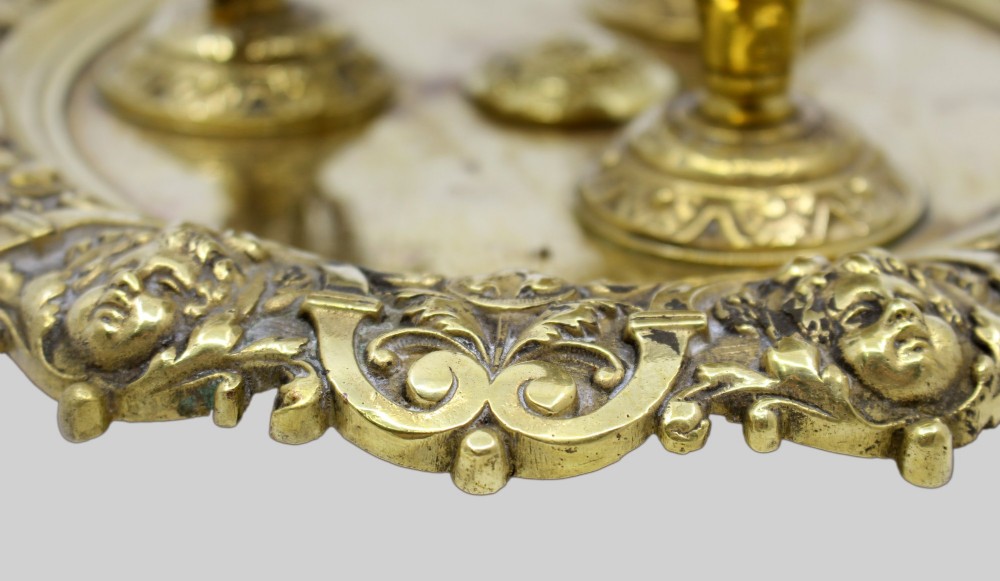A 19th-century cast brass writing desk set featuring an ornate rimmed tray, two urn-shaped pots, and a small chamberstick. View XIII