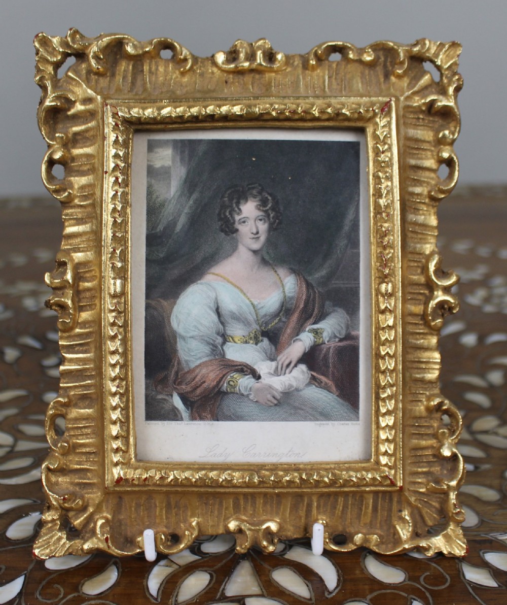 An early 19th-century coloured mezzotint portrait print depicting Lady Carrington, presented inside an ornate carved gold-gilded frame.