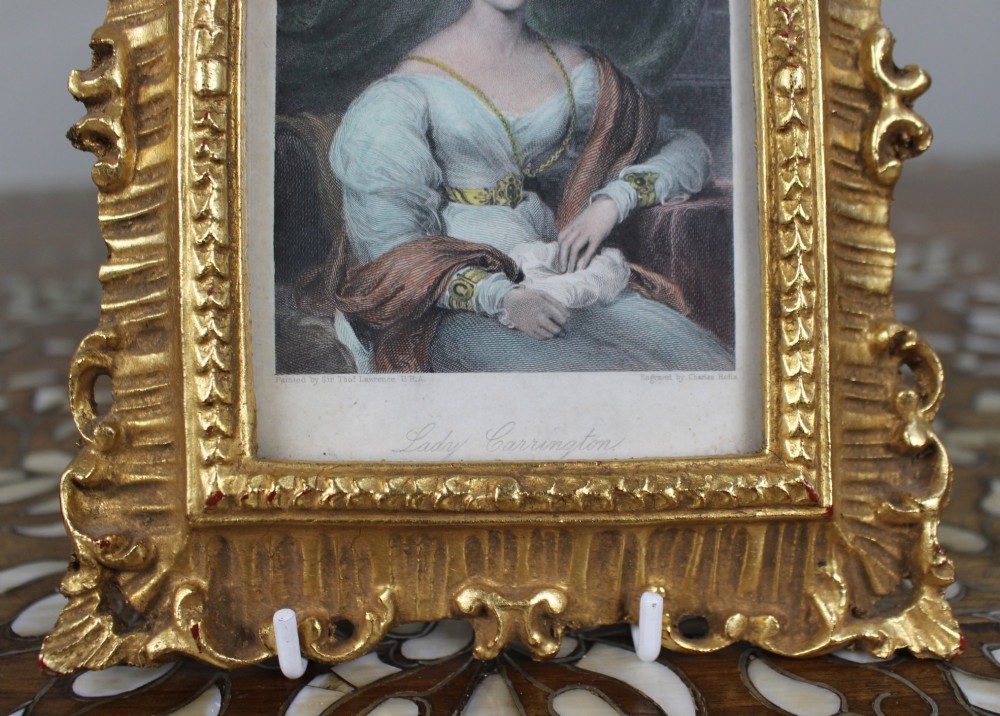 An early 19th-century coloured mezzotint portrait print depicting Lady Carrington, presented inside an ornate carved gold-gilded frame. View III