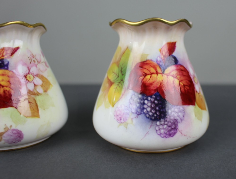 A pair of small white porcelain vases with wavy gilded rims, hand-painted with ripe blackberries, blossoms, and autumn foliage. View III