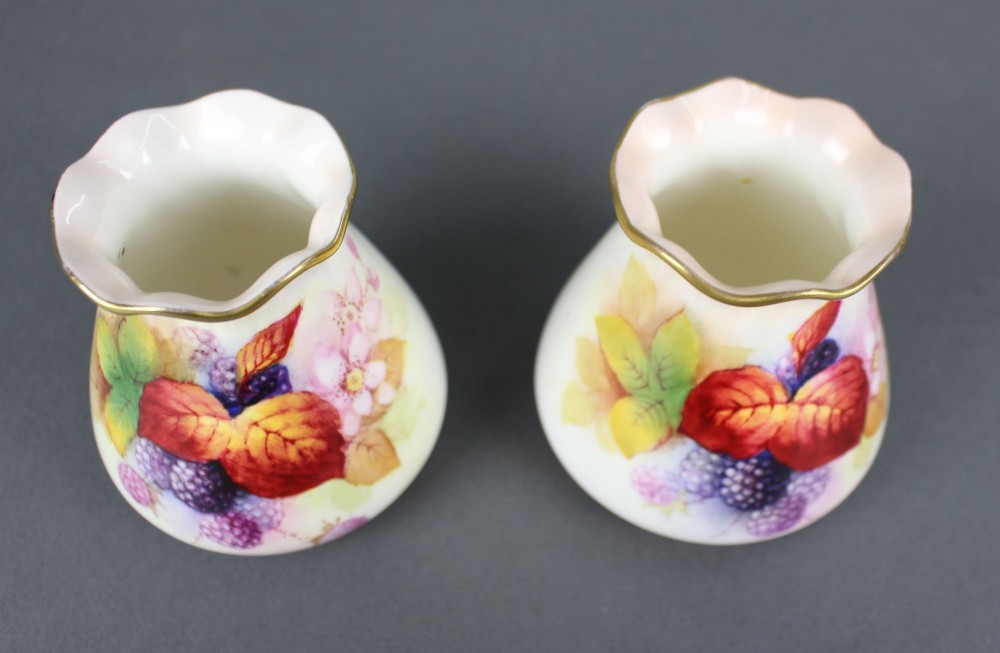 A pair of small white porcelain vases with wavy gilded rims, hand-painted with ripe blackberries, blossoms, and autumn foliage. View IV