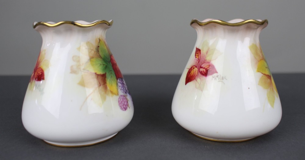 A pair of small white porcelain vases with wavy gilded rims, hand-painted with ripe blackberries, blossoms, and autumn foliage. View V