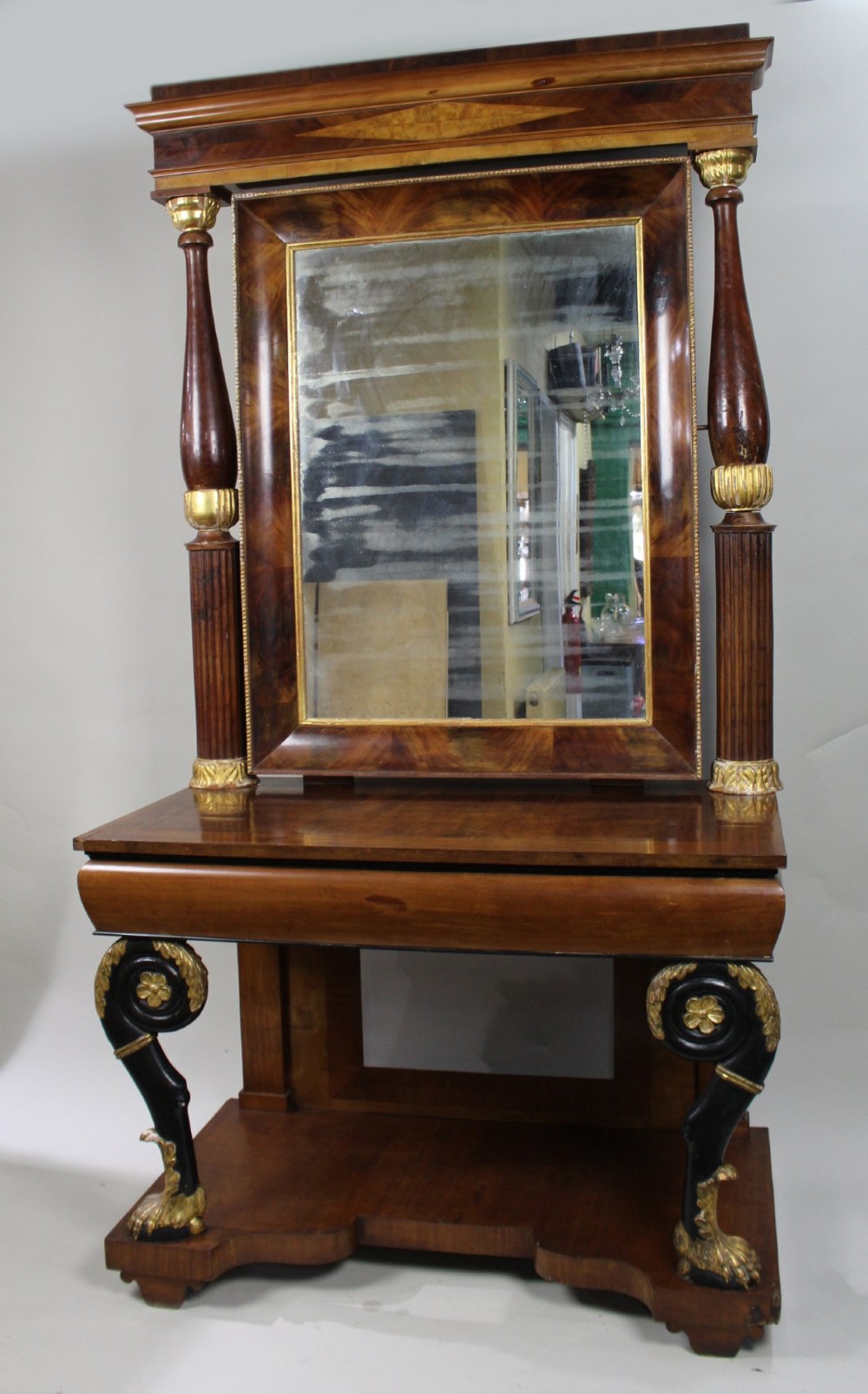 An antique mahogany pier console table featuring carved parcel gilt columns, ebonised monopodia legs with paw feet, and an integrated rectangular pier mirror. View II