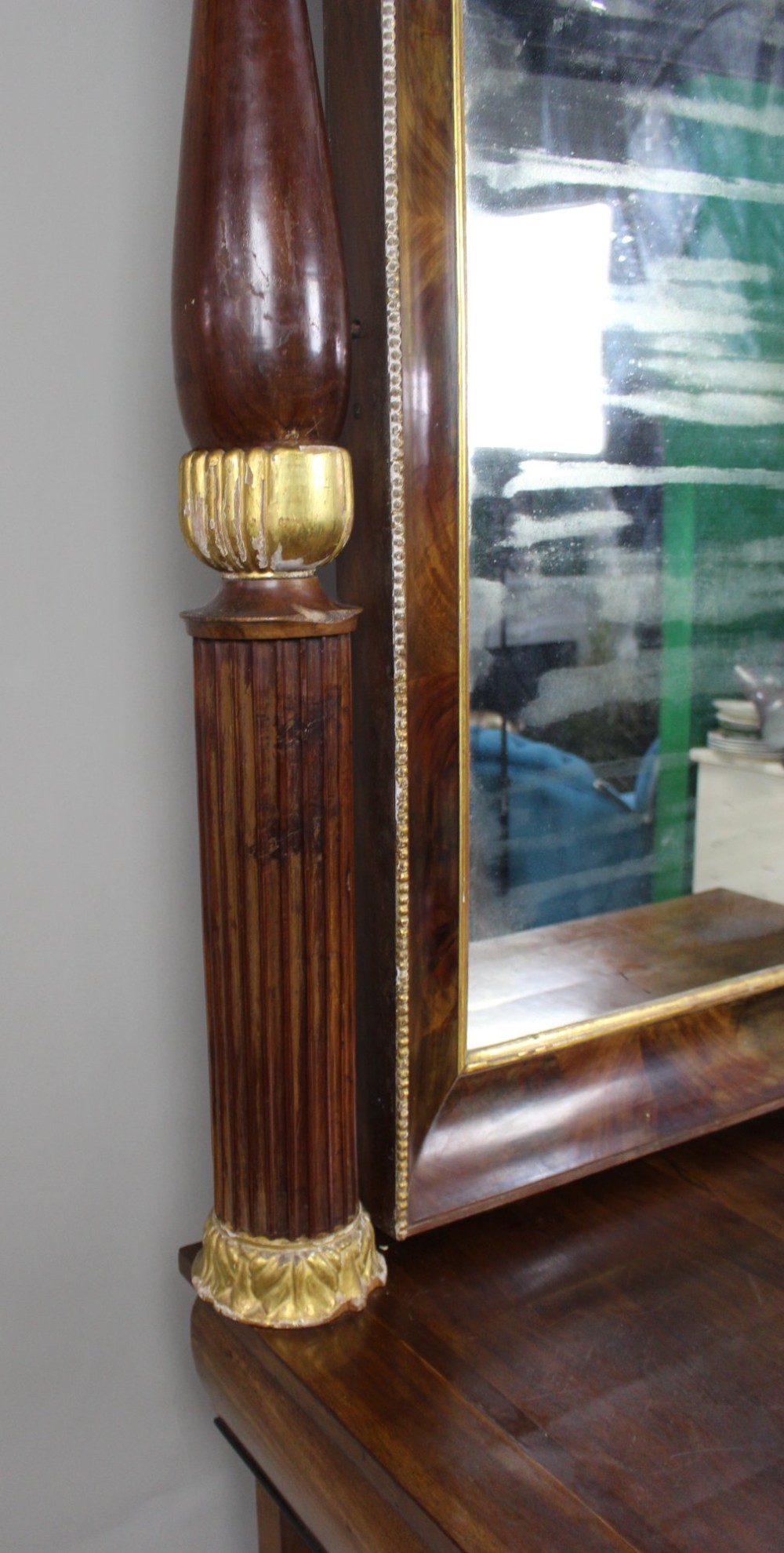 An antique mahogany pier console table featuring carved parcel gilt columns, ebonised monopodia legs with paw feet, and an integrated rectangular pier mirror. View XII