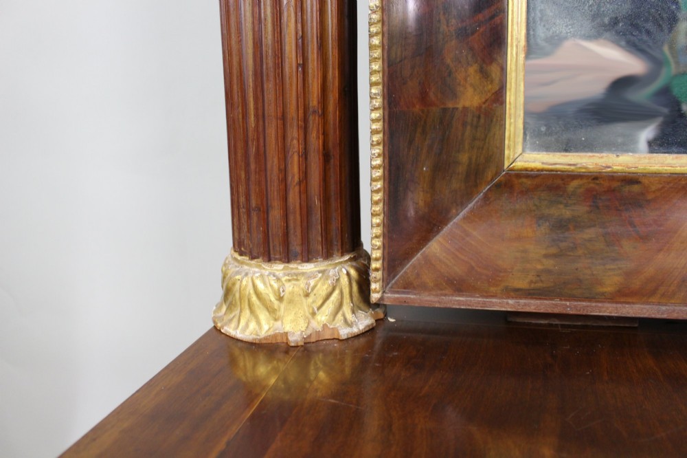 An antique mahogany pier console table featuring carved parcel gilt columns, ebonised monopodia legs with paw feet, and an integrated rectangular pier mirror. View XIII