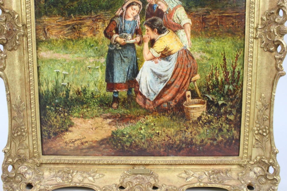 A 19th-century Victorian oil painting depicting figures outdoors feeding a kitten, enclosed within an elaborate carved gilt frame. View IV