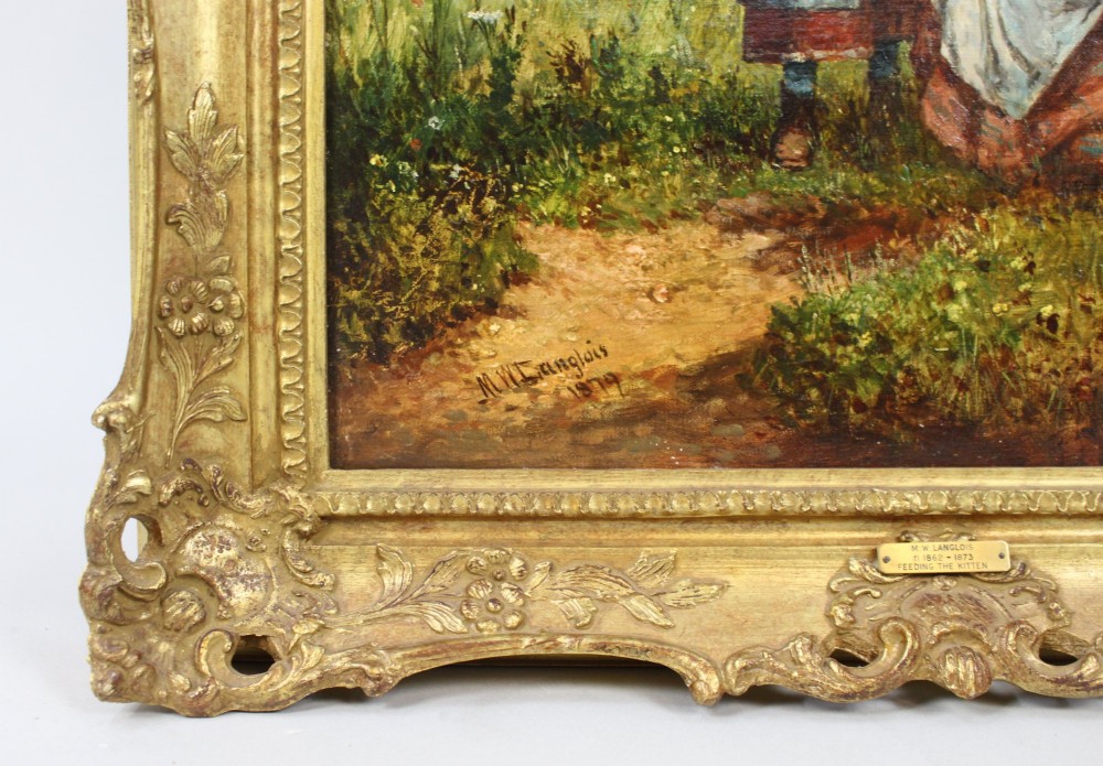 A 19th-century Victorian oil painting depicting figures outdoors feeding a kitten, enclosed within an elaborate carved gilt frame. View V