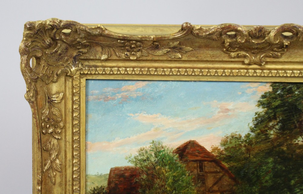A 19th-century Victorian oil painting depicting figures outdoors feeding a kitten, enclosed within an elaborate carved gilt frame. View VII