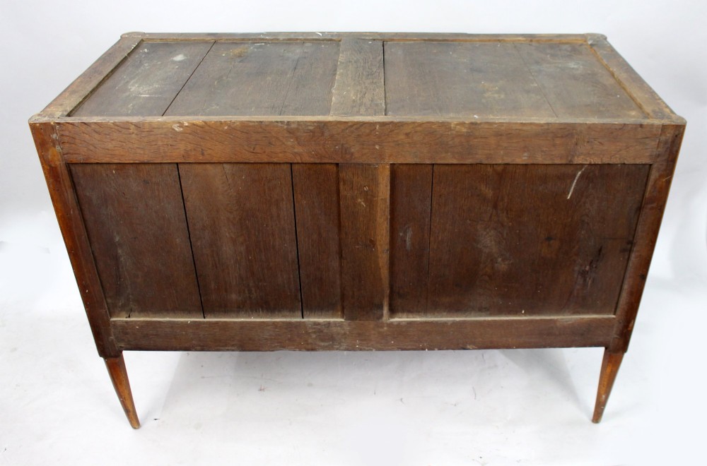 An 18th-century French Louis XVI commode featuring geometric parquetry wood inlay, tapered legs, brass ring handles, and a grey marble top. View XIII