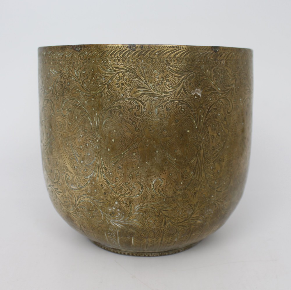 A rounded antique brass cachepot featuring densely hand-engraved floral foliage, figural motifs, and stippled background detailing. View IV