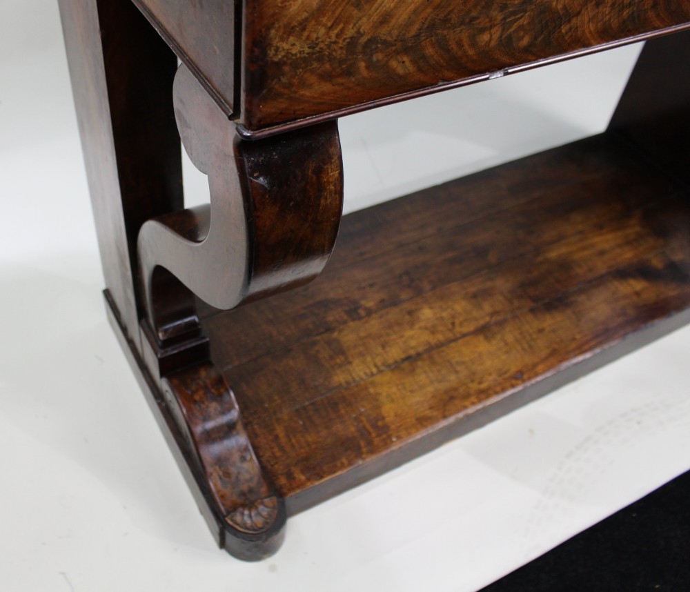 An antique dark mahogany French console table featuring a grey and white mottled marble top, curved scroll legs, and a low plinth shelf. View X