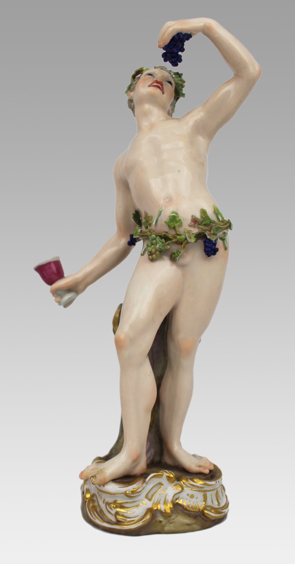 A set of four 19th-century hand-painted porcelain figurines representing the seasons standing on gilded scroll bases. View VII