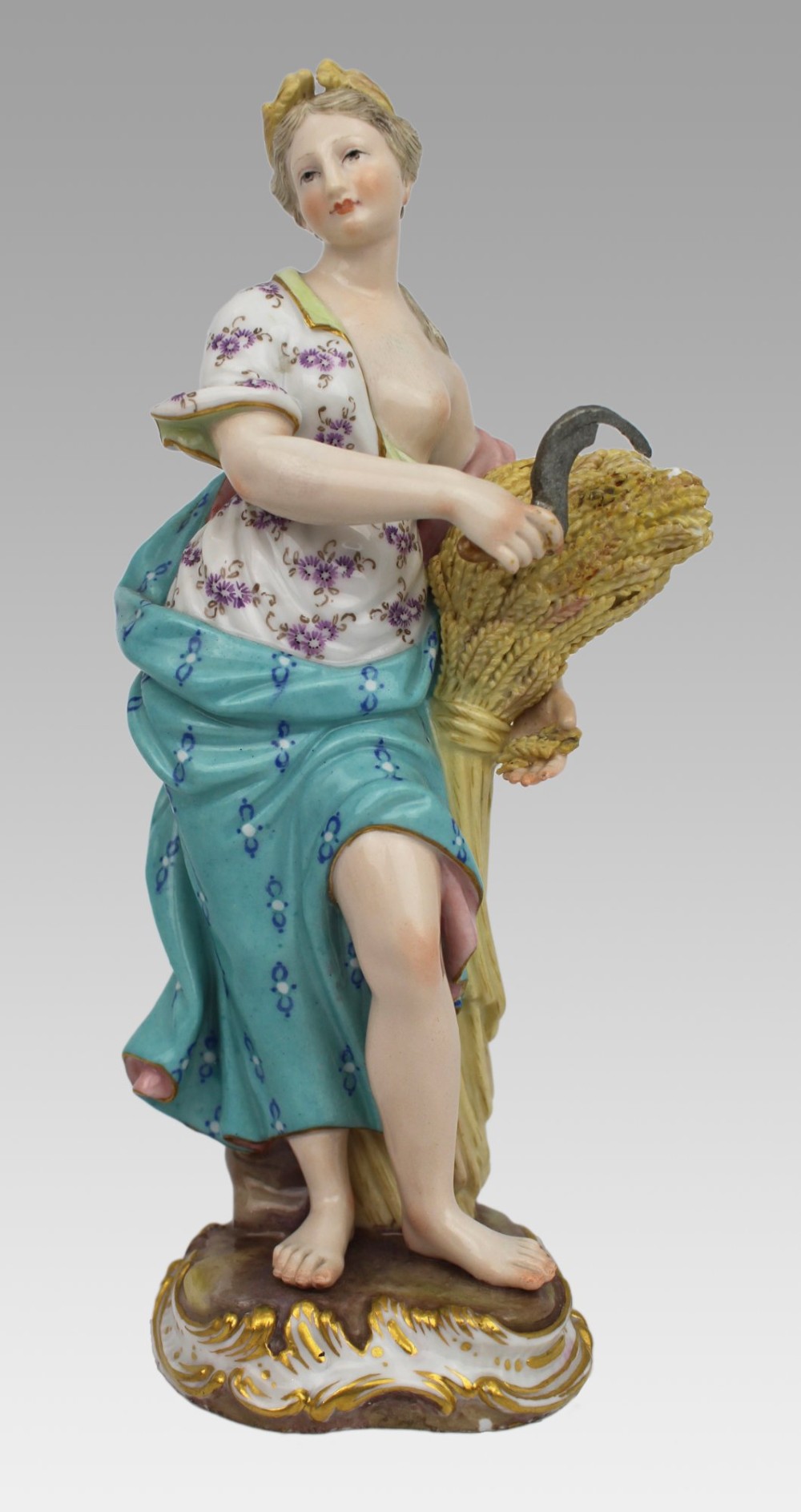 A set of four 19th-century hand-painted porcelain figurines representing the seasons standing on gilded scroll bases. View X