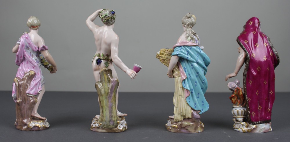 A set of four 19th-century hand-painted porcelain figurines representing the seasons standing on gilded scroll bases. View XV