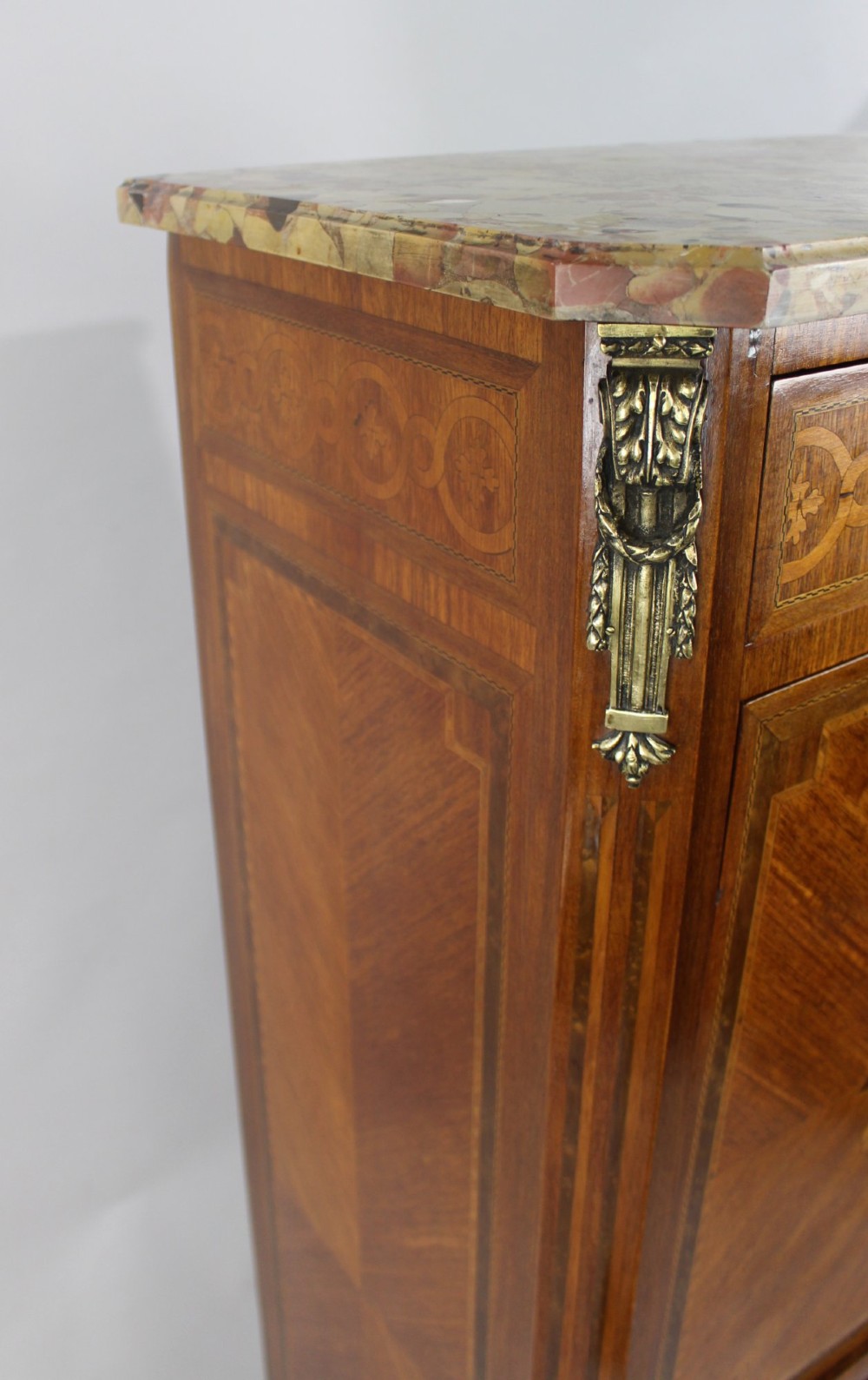A tall 19th-century French Louis XV style escritoire featuring floral marquetry inlays on a drop-front fall, three lower drawers, cabriole legs, gilt metal mounts, and a marble top. View V