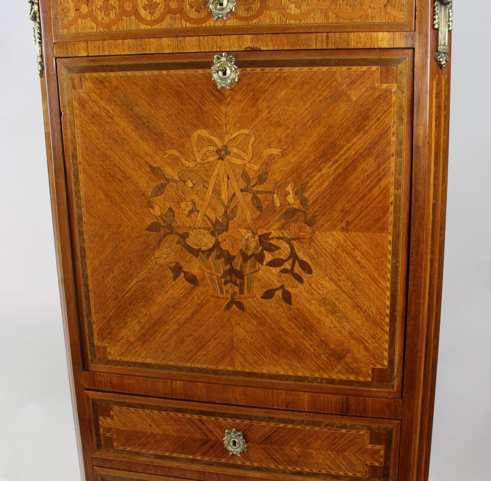 A tall 19th-century French Louis XV style escritoire featuring floral marquetry inlays on a drop-front fall, three lower drawers, cabriole legs, gilt metal mounts, and a marble top. View VI