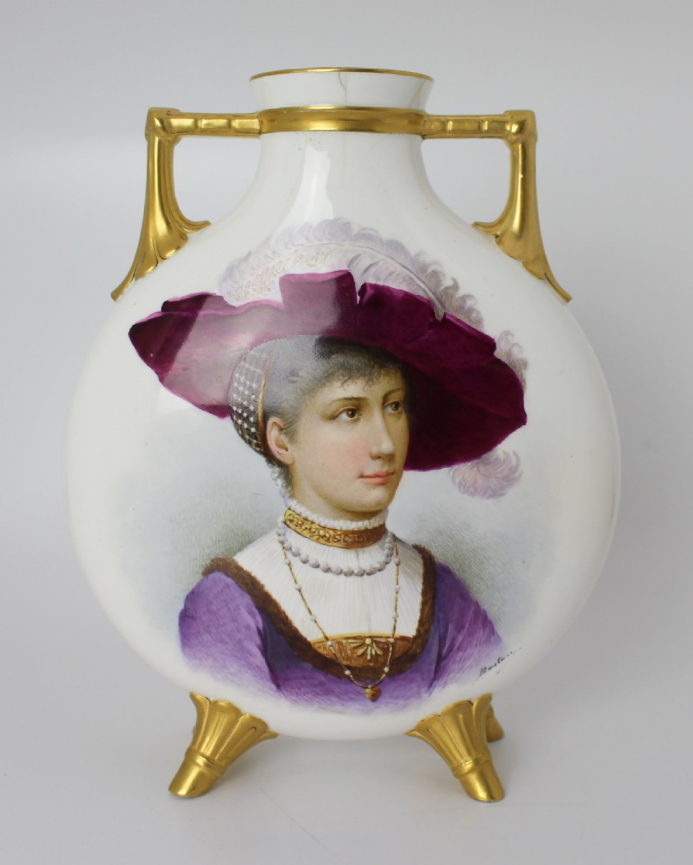 A white porcelain moon flask vase with twin gilded handles, four scroll feet, and a hand-painted portrait of a woman in a purple hat signed Baston. View VIII