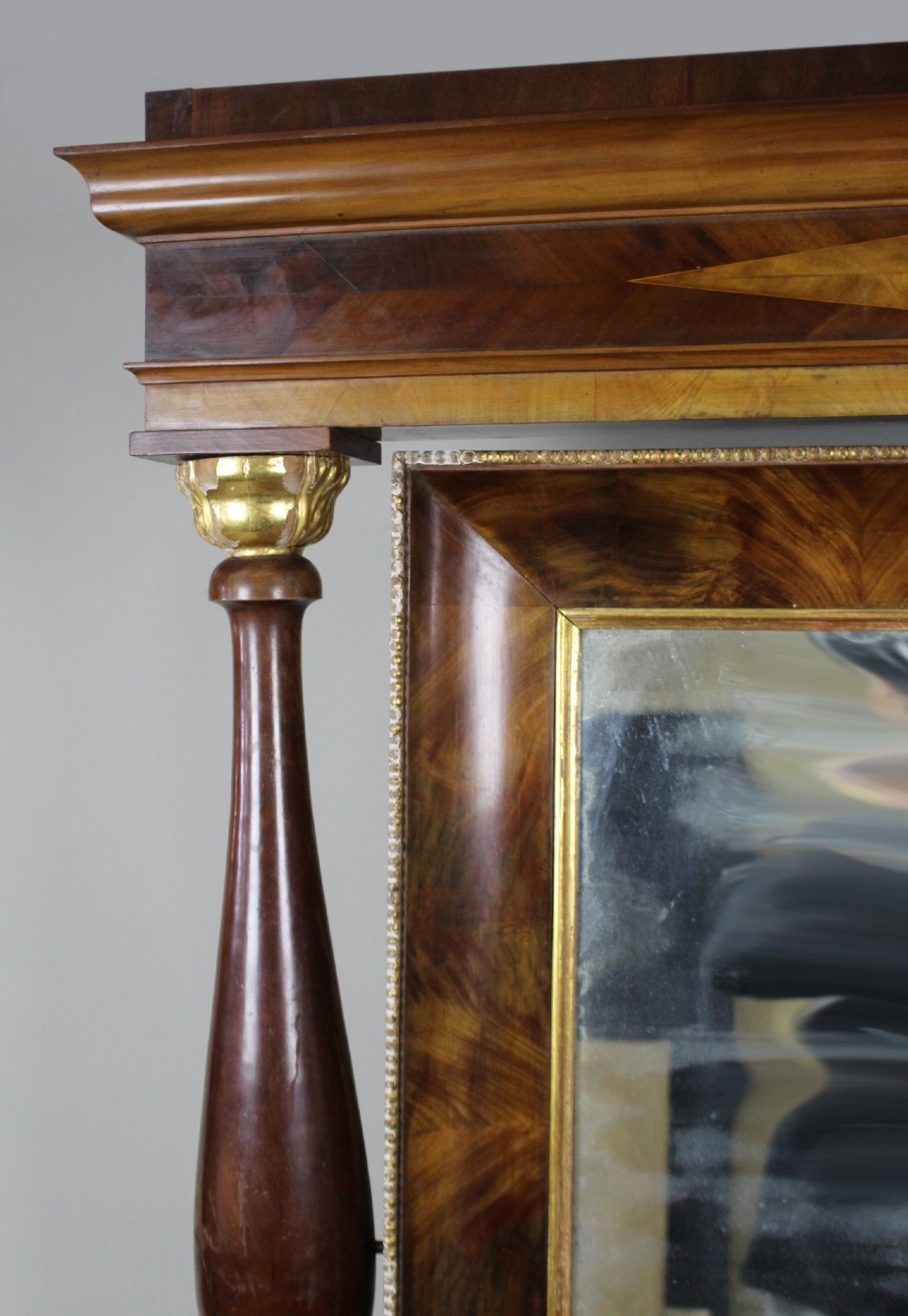 An antique mahogany console table and matching pier mirror featuring ebonised scroll legs with gilt paw feet and reeded columns. View IX
