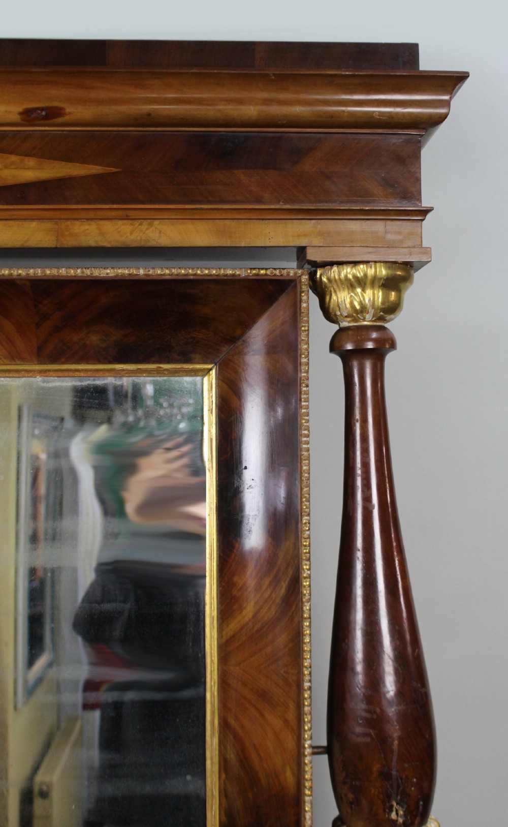 An antique mahogany console table and matching pier mirror featuring ebonised scroll legs with gilt paw feet and reeded columns. View XI