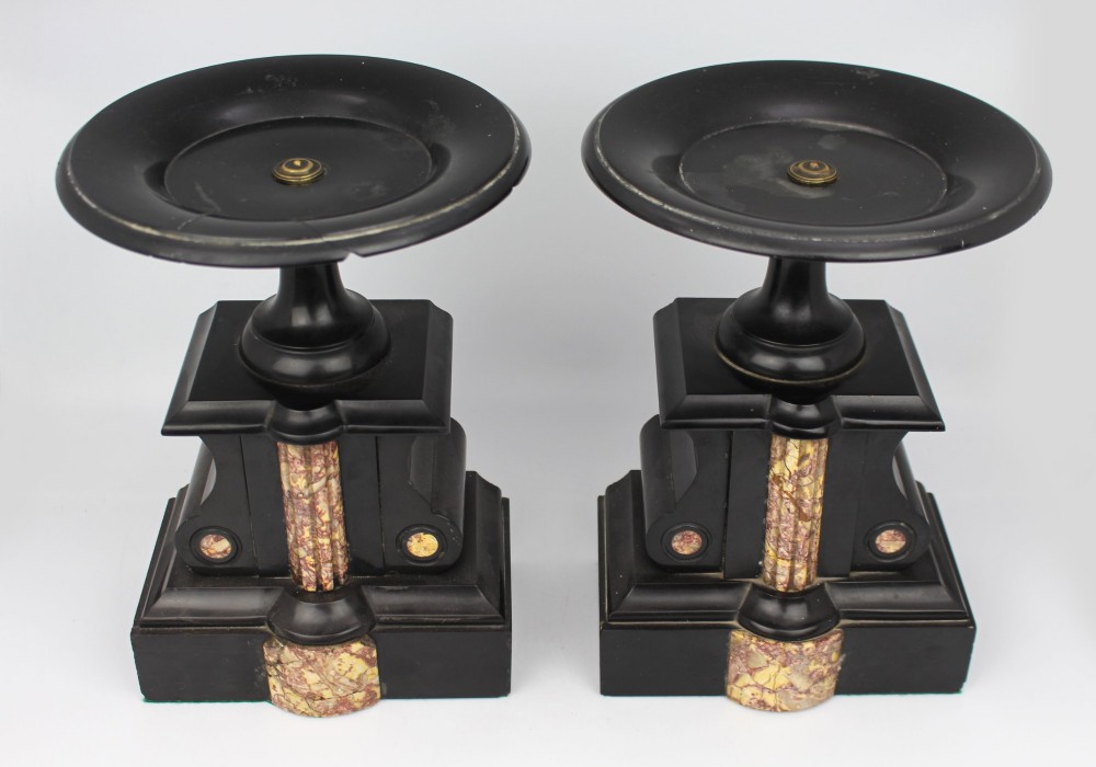 A 19th-century French black slate and red variegated marble clock garniture set with a central architectural clock and flanking side tazzas. View XII