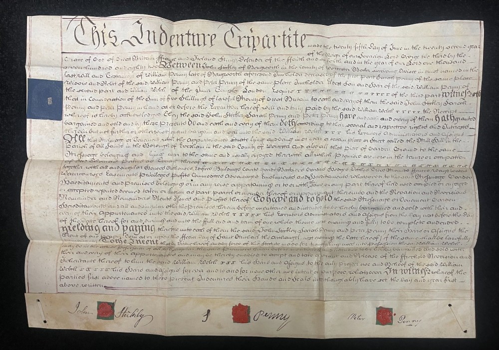 An 1782 handwritten George III vellum tripartite legal indenture featuring ornate calligraphy, a blue revenue stamp, and three red wax seals along the bottom edge.