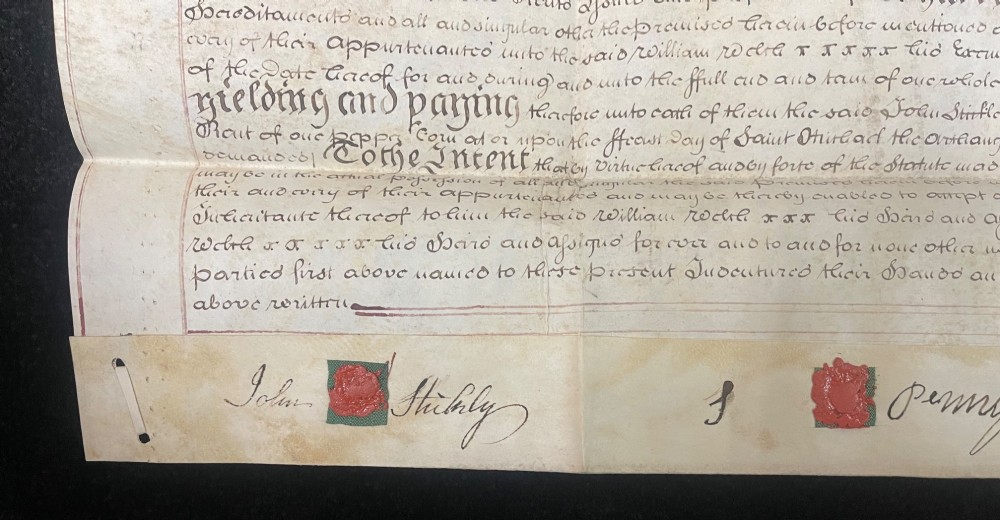 An 1782 handwritten George III vellum tripartite legal indenture featuring ornate calligraphy, a blue revenue stamp, and three red wax seals along the bottom edge. View IV