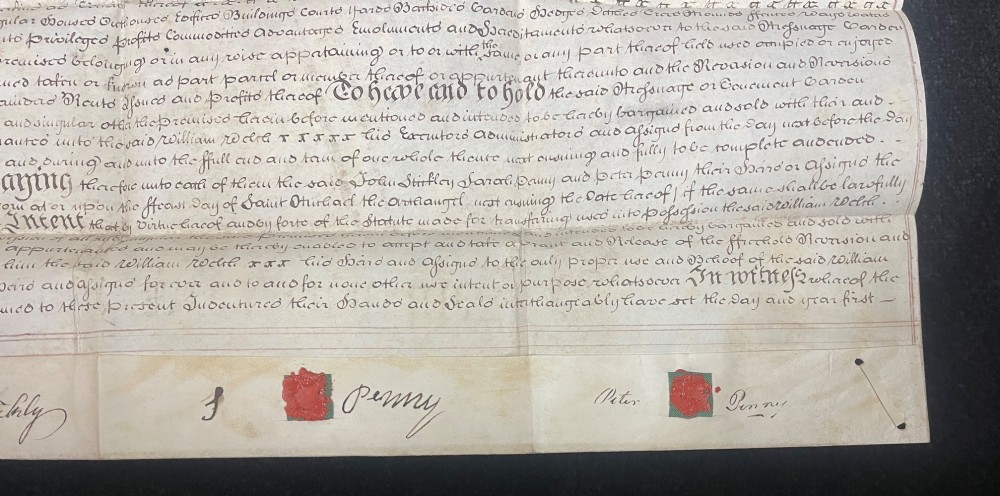 An 1782 handwritten George III vellum tripartite legal indenture featuring ornate calligraphy, a blue revenue stamp, and three red wax seals along the bottom edge. View V