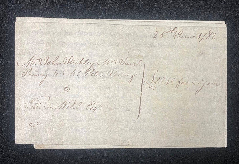 An 1782 handwritten George III vellum tripartite legal indenture featuring ornate calligraphy, a blue revenue stamp, and three red wax seals along the bottom edge. View X