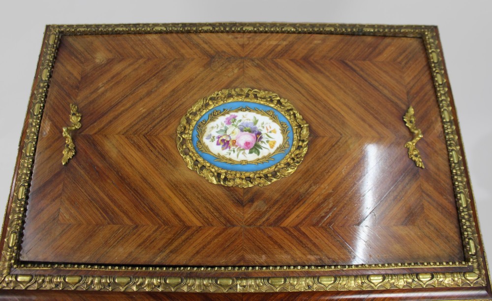A 19th-century French kingwood jardiniere table featuring geometric parquetry inlay, ornate gilt-bronze mounts, cabriole legs, and a central floral porcelain plaque. View VIII