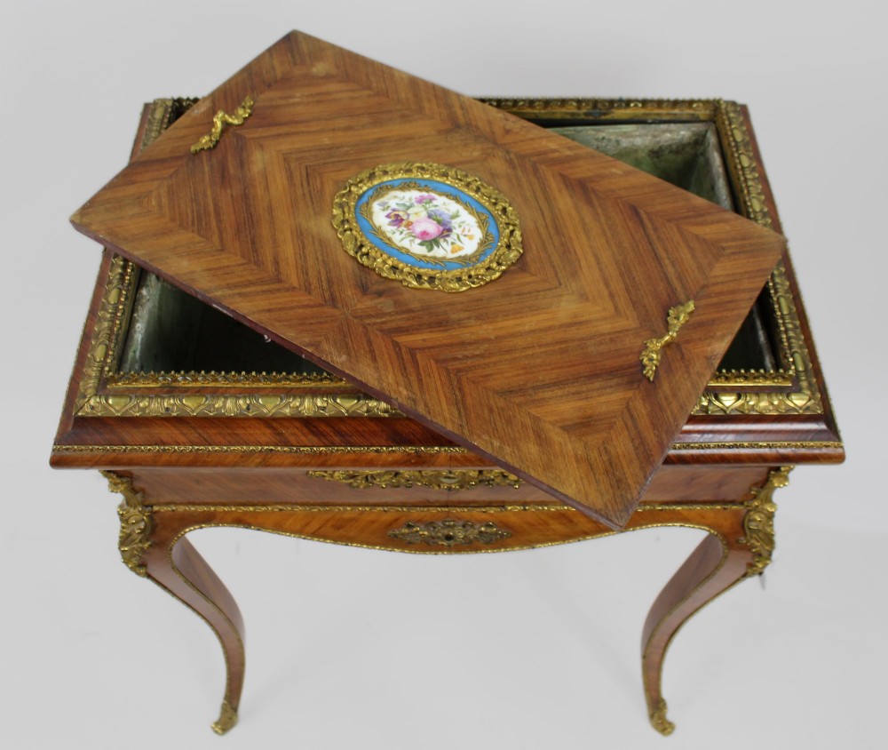 A 19th-century French kingwood jardiniere table featuring geometric parquetry inlay, ornate gilt-bronze mounts, cabriole legs, and a central floral porcelain plaque. View IX