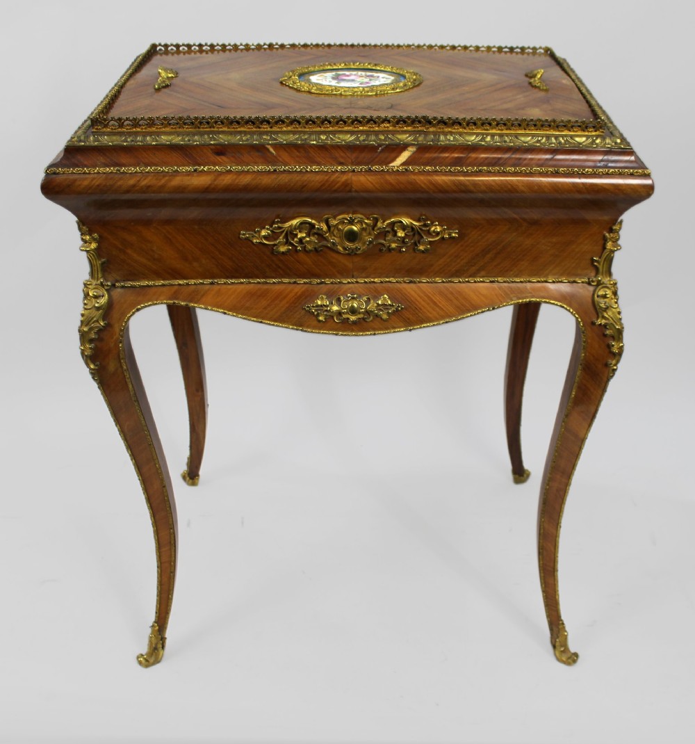 A 19th-century French kingwood jardiniere table featuring geometric parquetry inlay, ornate gilt-bronze mounts, cabriole legs, and a central floral porcelain plaque. View XI