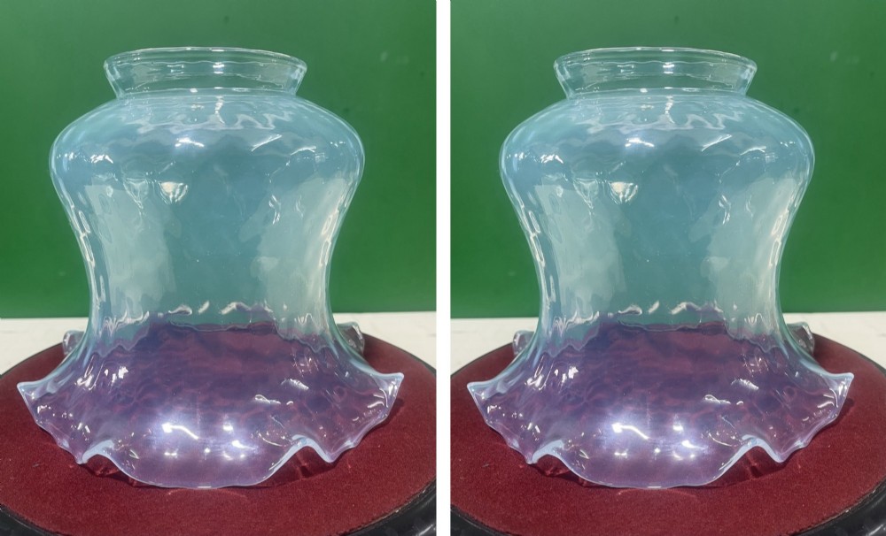 A pair of Victorian opalescent glass light shades featuring flared wavy lower rims and a pale blue translucent finish.