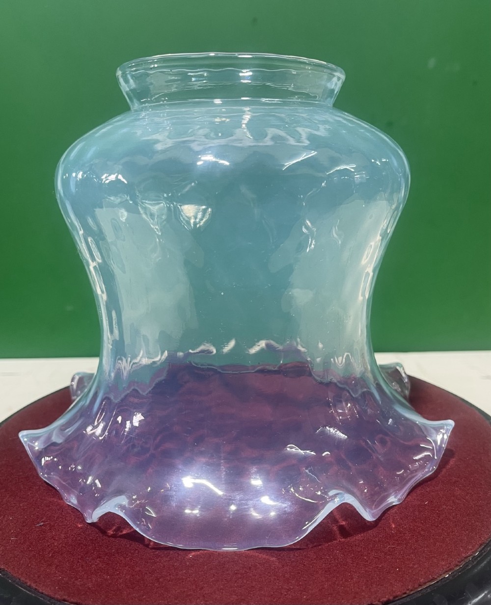 A pair of Victorian opalescent glass light shades featuring flared wavy lower rims and a pale blue translucent finish. View II