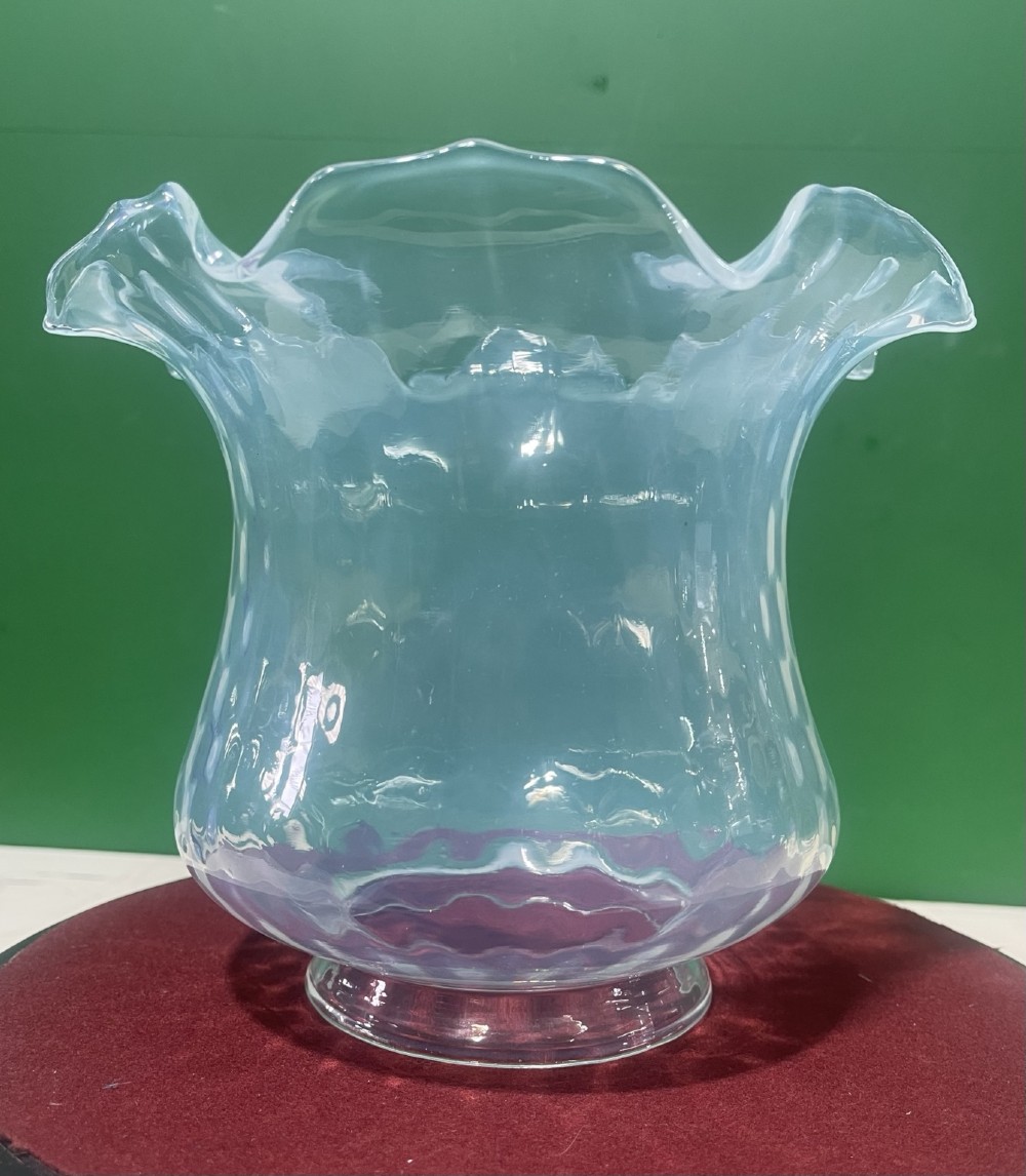 A pair of Victorian opalescent glass light shades featuring flared wavy lower rims and a pale blue translucent finish. View V