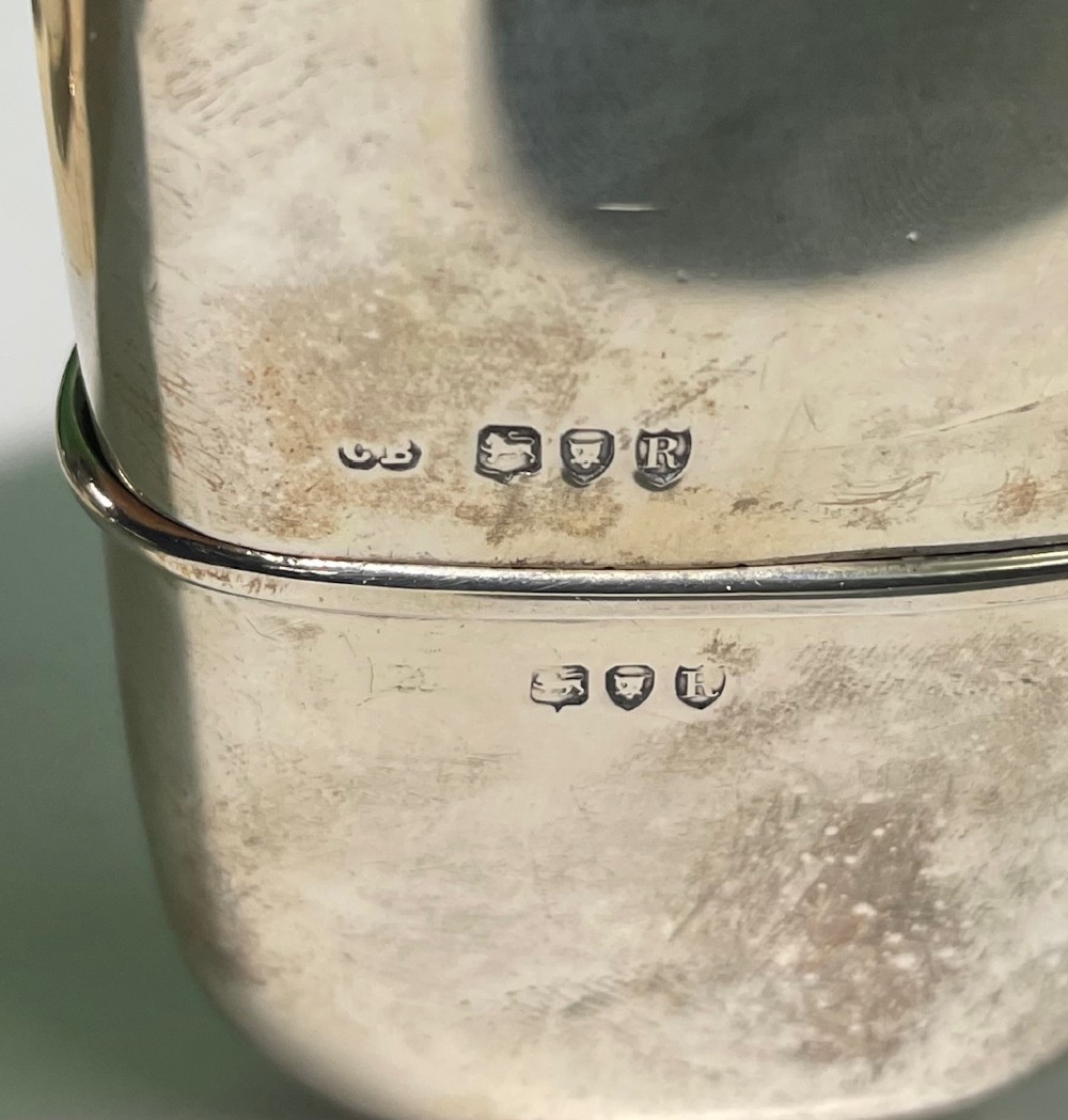 A late Victorian sterling silver spirit flask featuring a domed top and visible London hallmark stamps on the body. View VI